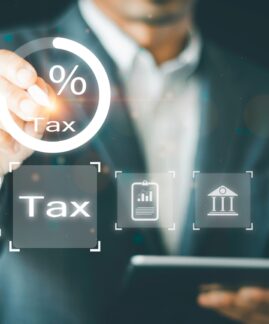 Businessman,Calculates,Tax,For,Individual,Income,Tax,Return,Form,Online